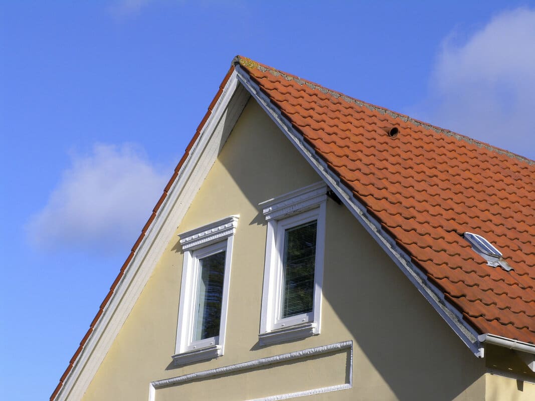 Dormer roof and shingles inspected for flashing issues